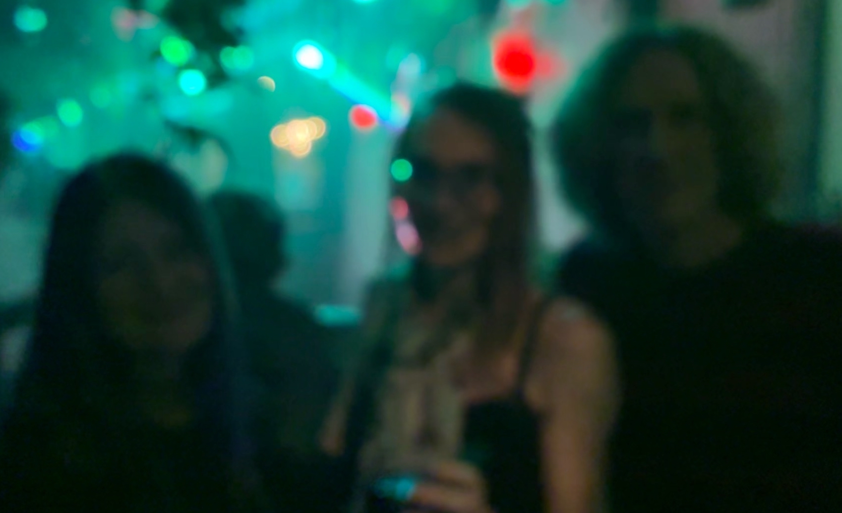 a blurry photo of me with the duo, brett and jayme.