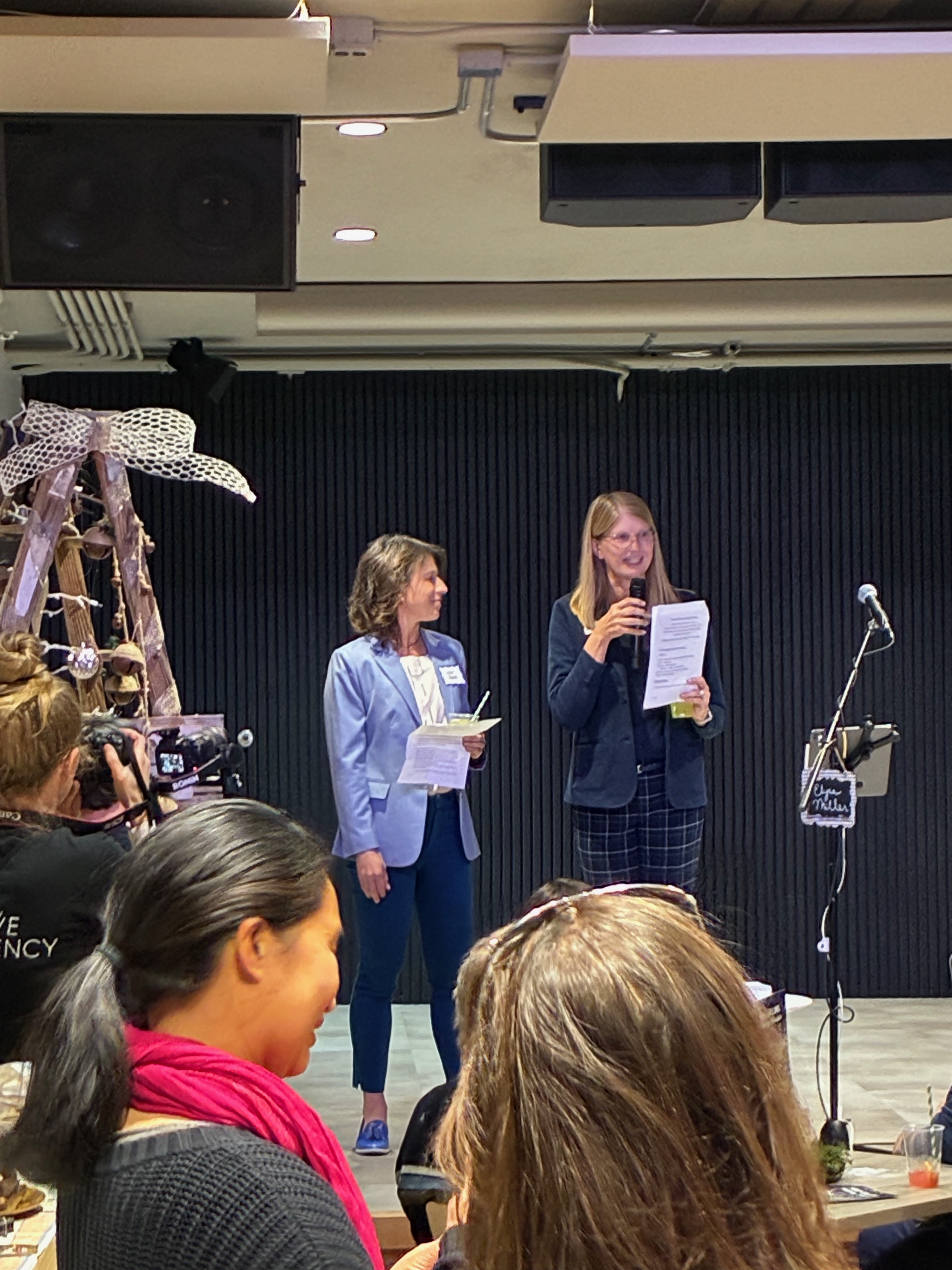 Emily Francis awaits a chance to speak briefly on the low-rise front stage.